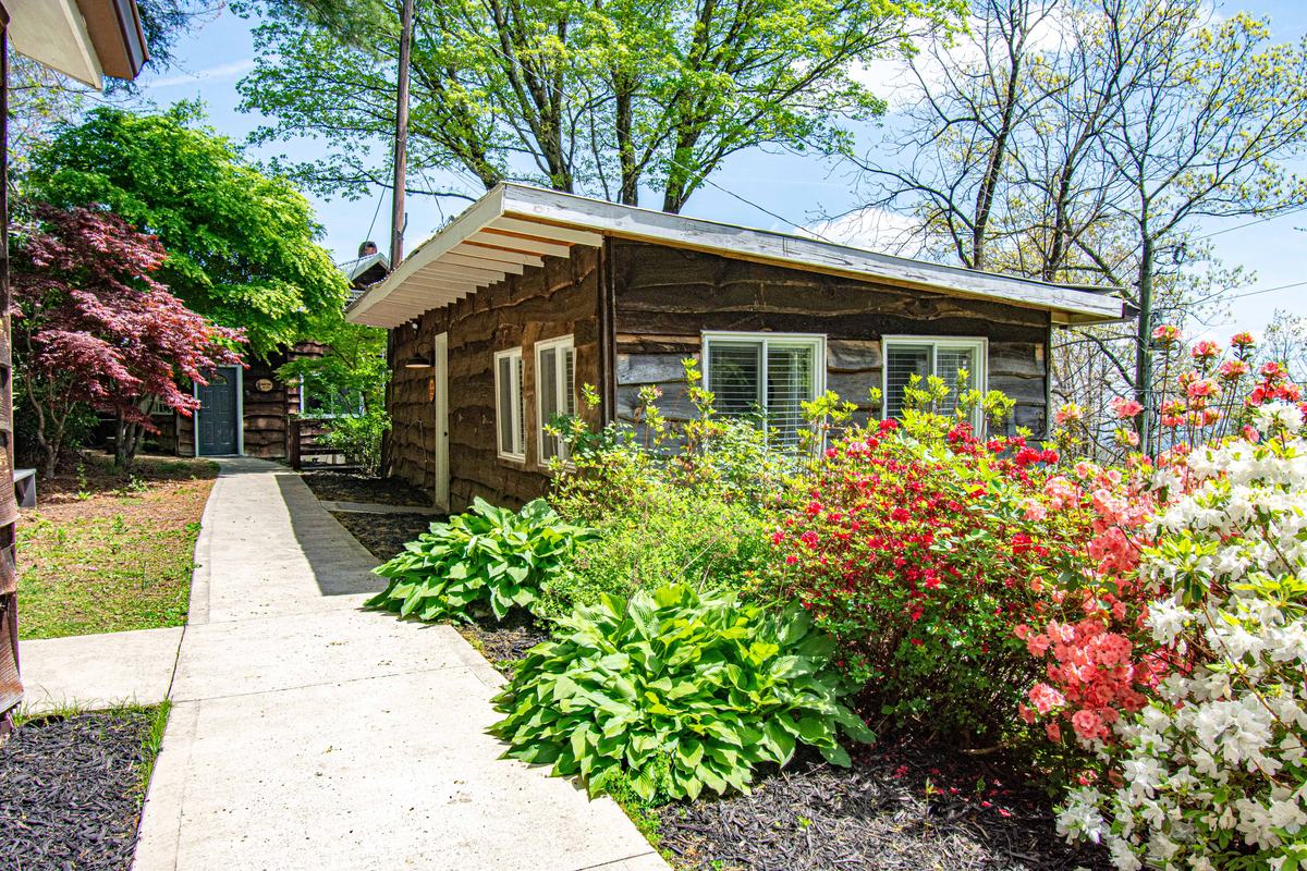 The Tiny Cabin exterior in spring at The Orchard