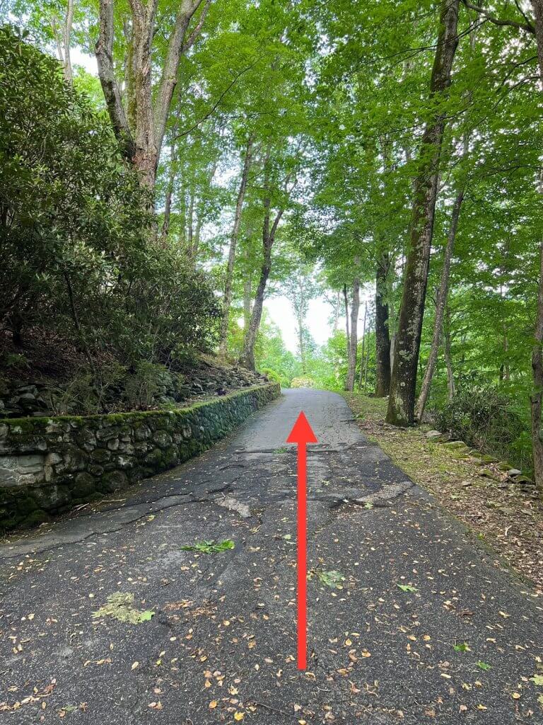 Continue uphill toward the house.