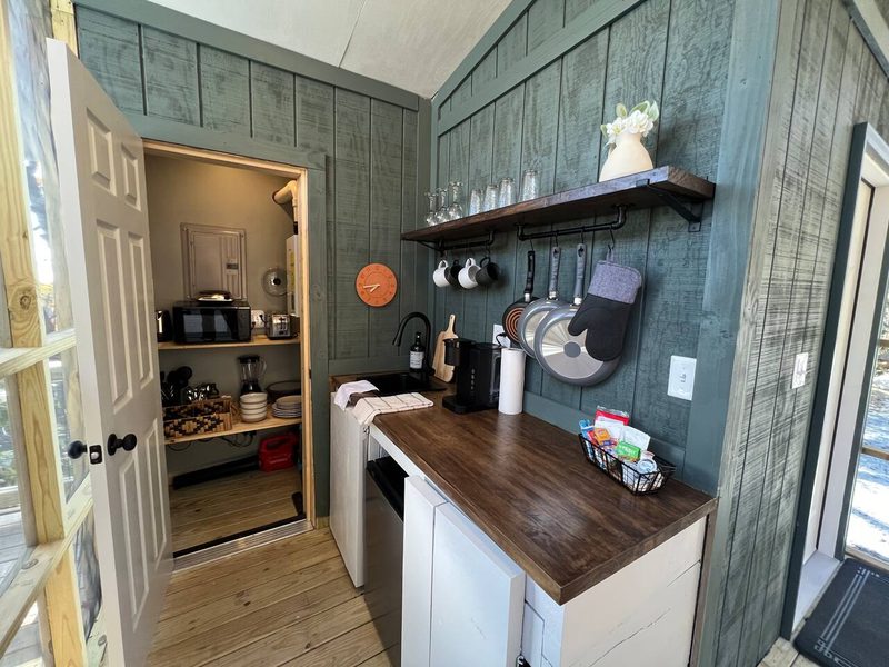 Here’s a quick shot of the kitchen made with the cabinets that we fashioned out of lumber straight from the mill.