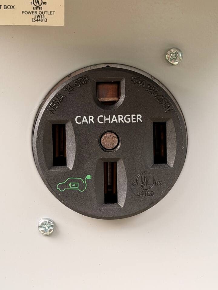 NEMA 14-50 outlet — bring your own portable EV charger / mobile connector
