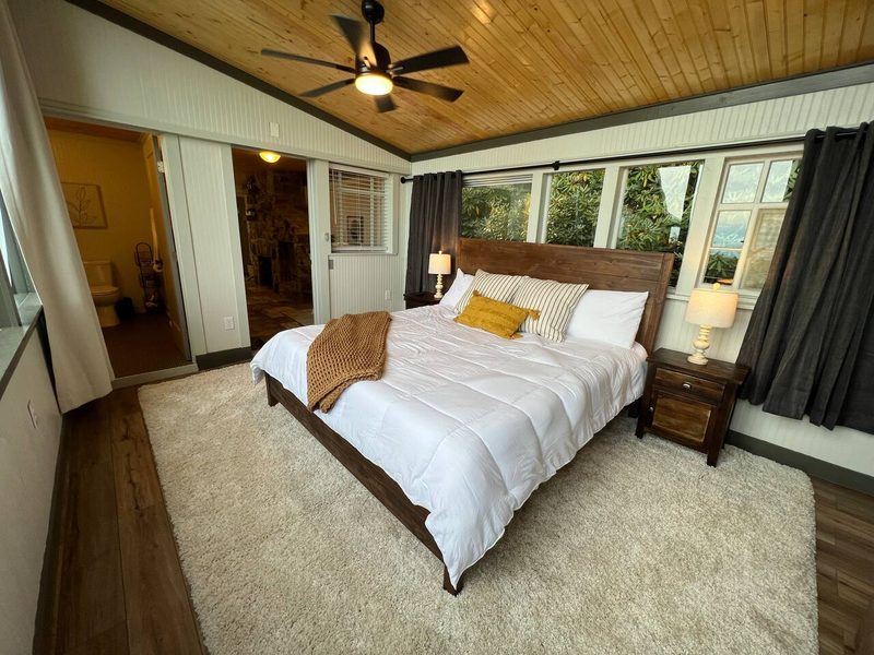 The master suite has windows on all four walls letting in light from every angle and nearly 270 degree views.