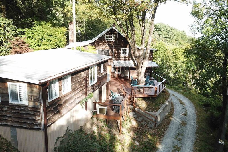 The tiny cabin is on the left and the larger cabin in the back over there.  This is the shared deck that inclu