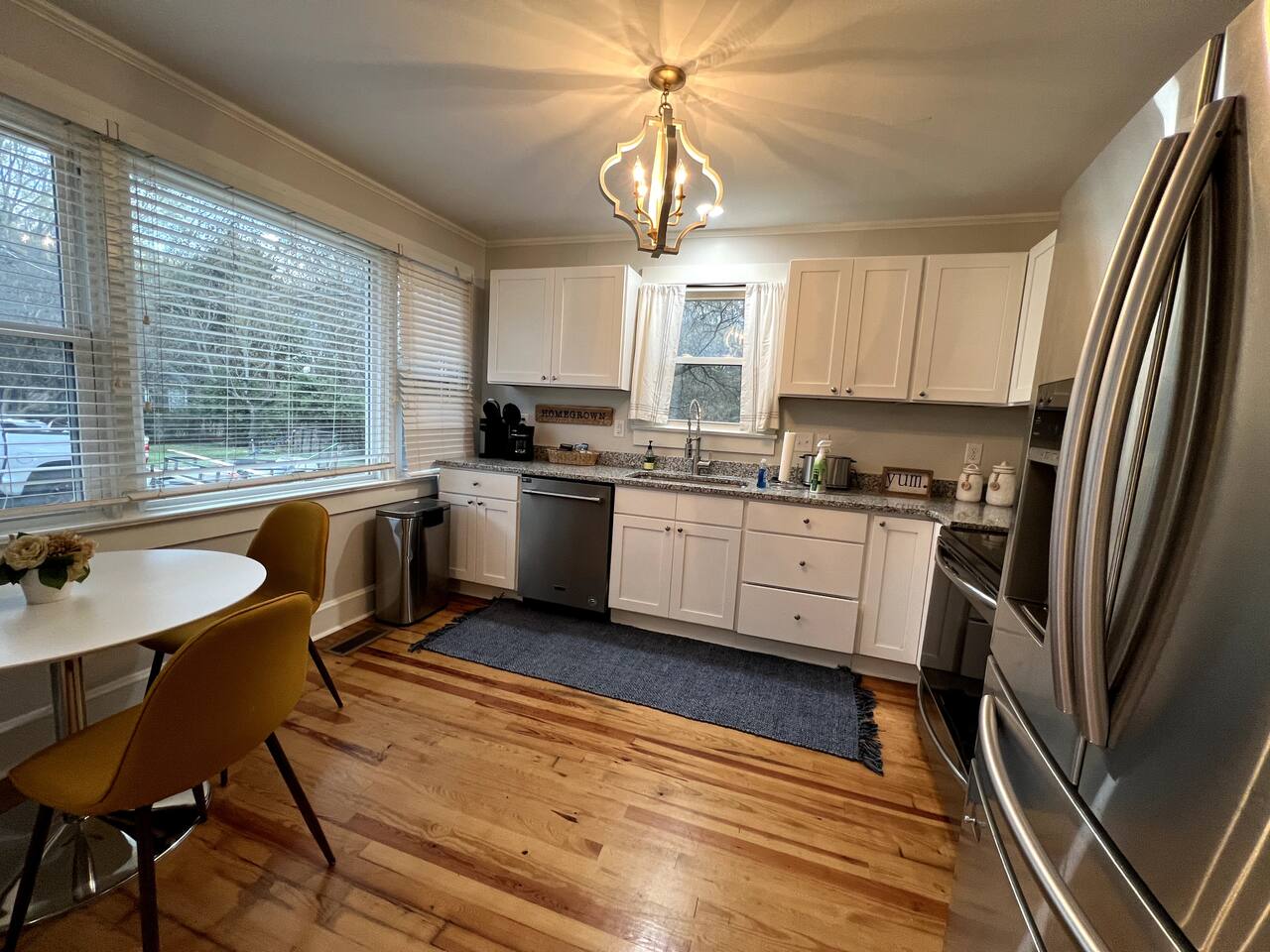Kitchen with granite counters and chandelier