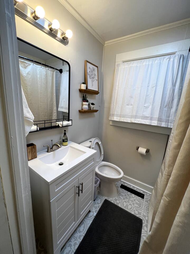 Second bathroom with tiled tub surround