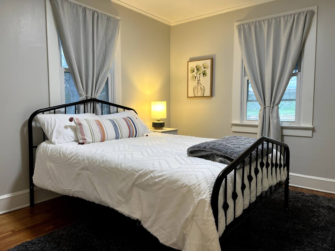 Second bedroom with wall-mounted TV