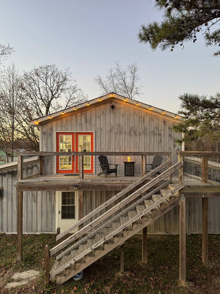 The barn at Wicker Branch with its upper deck and fire table at dusk