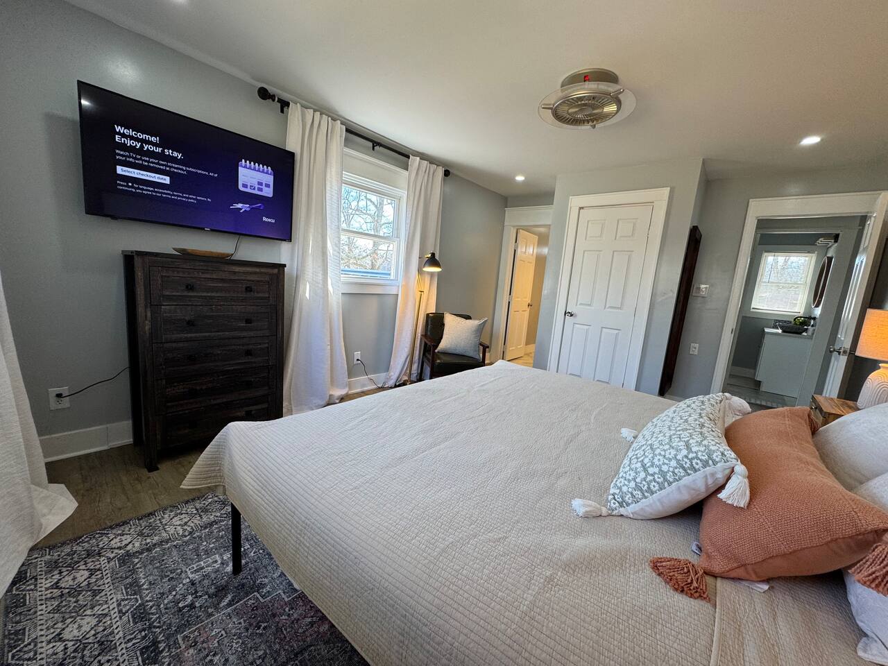 Main House bedroom with a TV and its own bathroom